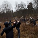 Police herd Swedish neo-Nazis into the woods near Kärrtorp, Stockholm on Sunday December 15th, 2013 after an anti-racism protest was attacked.Photo: TT