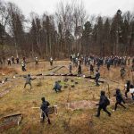 Police herd Swedish neo-Nazis into the woods near Kärrtorp, Stockholm on Sunday December 15th, 2013 after an anti-racism protest was attacked.Photo: TT