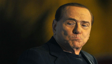 Berlusconi heckled at talks with leftist leader