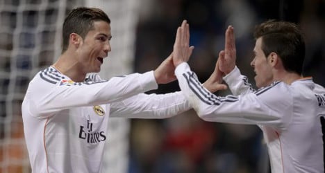 Ronaldo double keeps Real Madrid in title hunt