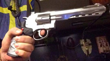 Man held after uploading Facebook gun photo