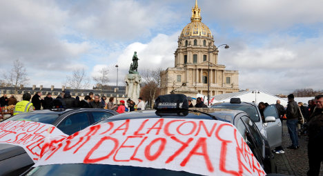 Paris taxi drivers 'attack' Uber cab in angry protest