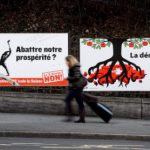 Swiss voters narrowly back immigration curbs