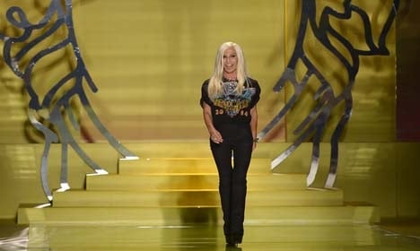 Versace agrees to sell minority stake to US firm