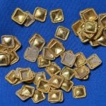 These gold decorations from a ceremonial garment were found by illegal treasure hunters in a forest in Rhineland-Palatinate.Photo: DPA