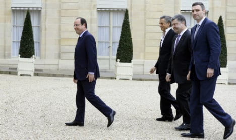 Hollande warns of 'new measures' against Russia