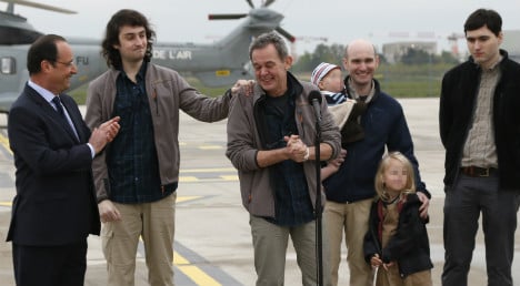 Freed journalists back on French soil