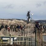 THURSDAY: Would-be immigrants from sub-Saharan spent much of Thursday six metres (20 feet) off the ground atop a border fence separating Morocco from the North African Spanish enclave of Melilla following a morning assault on the border in an attempt to cross into Spain.Photo: José Colón/AFP