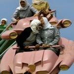 Young Palestinian women enjoy a roller coaster ride.Photo: Anja Niedringhaus/DPA