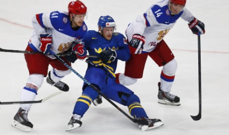 Swedes fall as Russia books hockey finals berth