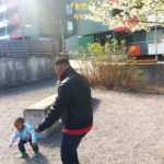 Andy Menga, 47, chases after his four-year-old Precieux. He moved from Congo ten years ago and has always felt safe in Sweden. "I heard about the riots on TV," he said.