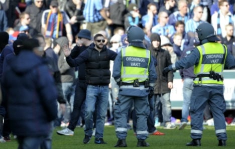 Football fans held for violence and Nazi chants