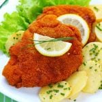 <b>4) Schnitzel with warm potato salad:</b> The first thing my friend from NY wanted to eat when he came to Germany for the first time, was Schnitzel. A big Wiener Schnitzel. The biggest one we could find. Schnitzel with warm potato salad or Pommes (chips) is probably one of the best-loved German dishes around the world. Just seeing my friend's happy contented face as he polished off the last crumb said it all. Photo: Photo: Shutterstock