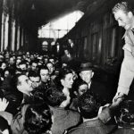 1955: 18-year-old prince Juan Carlos is warmly greeted by a crowd at a Madrid station. Juan Carlos was born  in Rome in 1938, but his exiled grandfather King Alfonso VIII convinced Spanish dictator Francisco Franco to allow the young Juan Carlos to return to Spain to complete his studies in 1948. Photo: AFP