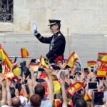 Spain's King Felipe VI waves on arrival to the Palacio de Oriente or Royal Palace in Madrid on June 19, 2014 following a swearing in ceremony of Spain's new King before both houses of parliament.Photo: Miguel Riopa/AFP