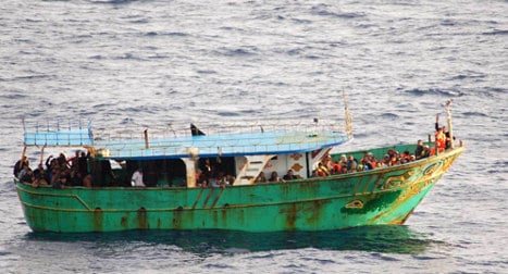 Sixty migrants 'stabbed to death by traffickers'