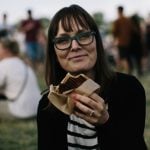 We caught Lea Sarfelt of Roskilde enjoying some toast from Hjaltes. "Really good! Especially when you have a hangover," she said. Photo: Bobby Anwar