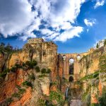 Ronda's 120-metre-tall Puente Nuevo (New Bridge) in Andalusia could easily be transformed into the imposing gates to the city of unknown kingdoms in upcoming GoT seasons. Photo: <a href="http://shutr.bz/1lz4JQz">Photo of Ronda, Andalusia</a> :Shutterstock