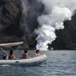Tourists flock to Italy’s erupting volcano