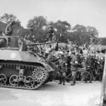 Cheering crowds, flanked by firemen, greets a tank of the Leclerc Division during the military parade, on August 26, 1944 , Place de la Concorde, the day after the Liberation of Paris.Photo: AFP