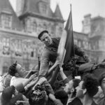 A French soldier of the Leclerc Division riding a tank is greeted by Parisians on August 25, 1944 in front of the city hall during the military parade marking the Liberation of Paris during World War II.Photo: AFP