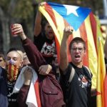 Pro-independence supporters gesture at anti-independence followers demonstrating for the unity of Spain in the centre of Barcelona.Photo: Josep Lago/AFP