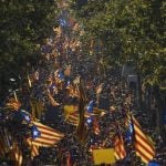 Thousands of people wave Catalan Estelada flags during the region's national day celebrations. The flag unofficially represents the bid for Catalan independence.  Photo: Lluis Gene/AFP