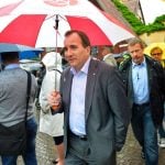 The election campaign really got underway at Almedalen, a week-long political event on the Swedish island of Gotland. Here we see Social Democrat head Stefan Löfven braving the summer rain on the way to giving a speech. Photo: TT