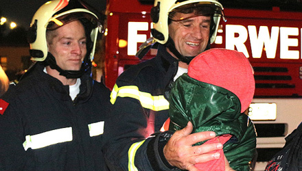Firemen rescue toddler from post box