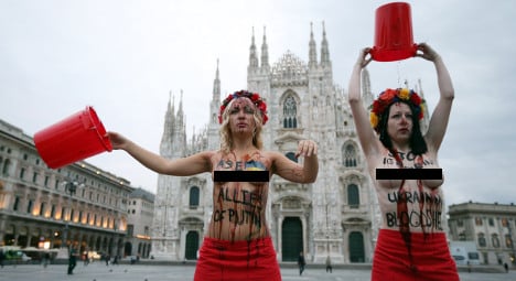 Putin targeted by topless protest at Milan summit
