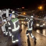 Stuttgart firefighters move a downed traffic light pole off the road after storms on Tuesday night.Photo: DPA