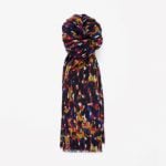 <b>3. Scarf</b><br>
Scarves serve the double purpose of being functional and fashionable. I prefer a neutral color that matches with everything, while some people use their scarf as the colorful or printed aspect of their outfit. Take a look at <a href="http://www.cosstores.com/dk/Shop/Women/Accessories/Hats_Scarves_Gloves/Printed_wool_scarf/10672463-22175345.1#22175348">these warm ones from COS</a>.Photo: COS Printed Wool Scarf