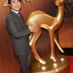 Chinese pianist Lang Lang was awarded the classical music award, though the statue he received was considerably smaller than this one that he's, er, coveting in this picture. Photo: DPA