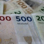 Danish central bank cuts rate as euro weakens