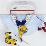 1st place, Sports. Canada's Sidney Crosby fires into the net, just behind Sweden's goalie Henrik Lundqvist, during the men's ice hockey final between Sweden and Canada at the 2014 Sochi Winter Olympics in February. Canada won the Olympic gold.Photo: Joel Marklund (Bildbyrån)/Årets Bild
