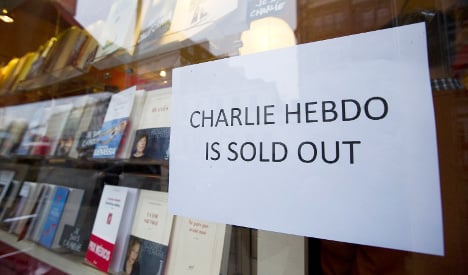 People queue abroad for new Charlie Hebdo mag