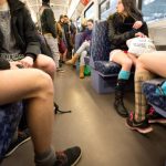 Participants in the annual No Pants Subway Ride sit without their trousers in Hamburg.Photo: DPA