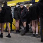 Berlin participants in No Pants Subway Ride leave the U-Bahn.Photo: DPA