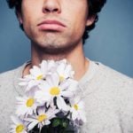 Tell an admirer you appreciate their friendship but don’t want to date them.Photo: <a href=”http://www.shutterstock.com/pic-167161316/stock-photo-sad-and-rejected-man-with-a-bouquet-of-flowers.html?src=v3wKT9fl17CWDBtWoC63LA-1-2”>Shutterstock</a>