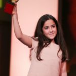 Hana Saeidi triumphantly accepts the Golden Bear for Best Film on behalf of her uncle Jafar Panahi. Panahi's film "Taxi" is the Iranian director's third film produced since being banned from the craft by his government. Photo: DPA