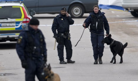Swedish police hunt two in triple murder case
