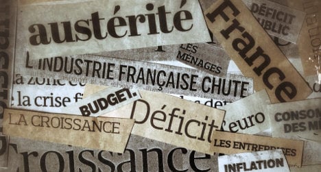 French government hails cut in public deficit