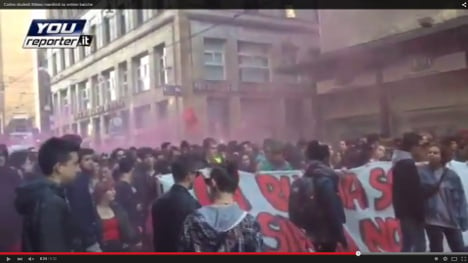 Students spray-paint police in Milan clashes
