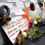 Condolence messages for the victims of the Germanwings plane crash are fixed on a pole in the departure area of the airport Duesseldorf