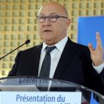 France unveils billions in savings to appease EU
