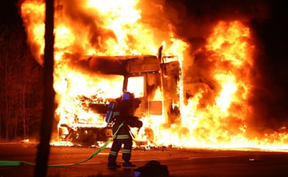 Huge transporter truck goes up in flames