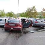 Woman drives into five cars in parking lot