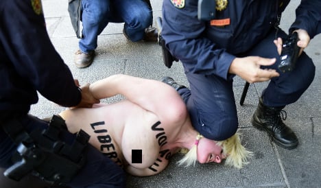Femen protestor corners Spain's interior minister