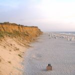 <b>Sylt.</b> Located in the North Sea, Sylt is Germany's northern most island. Pictured here, a beach with red cliffs in Kampen.Photo: <a href="http://bit.ly/1c7ptBu">jkb</a> / Wikimedia Commons.