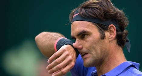 Federer faces ace server in Halle semifinals